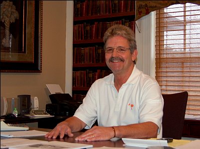 Frank Eck in his office at the desk